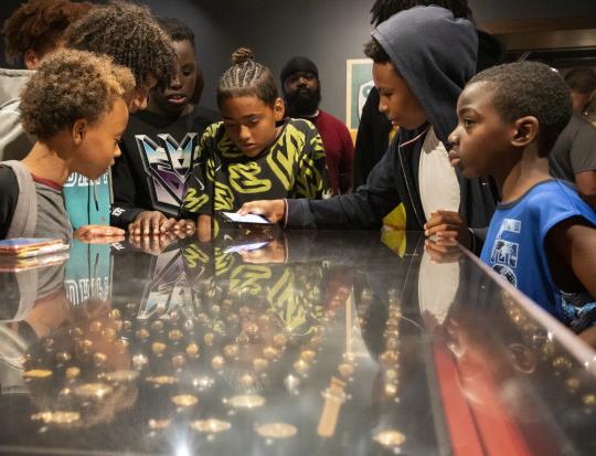 Students enjoying the Museum's Sacred Ground Exhibit