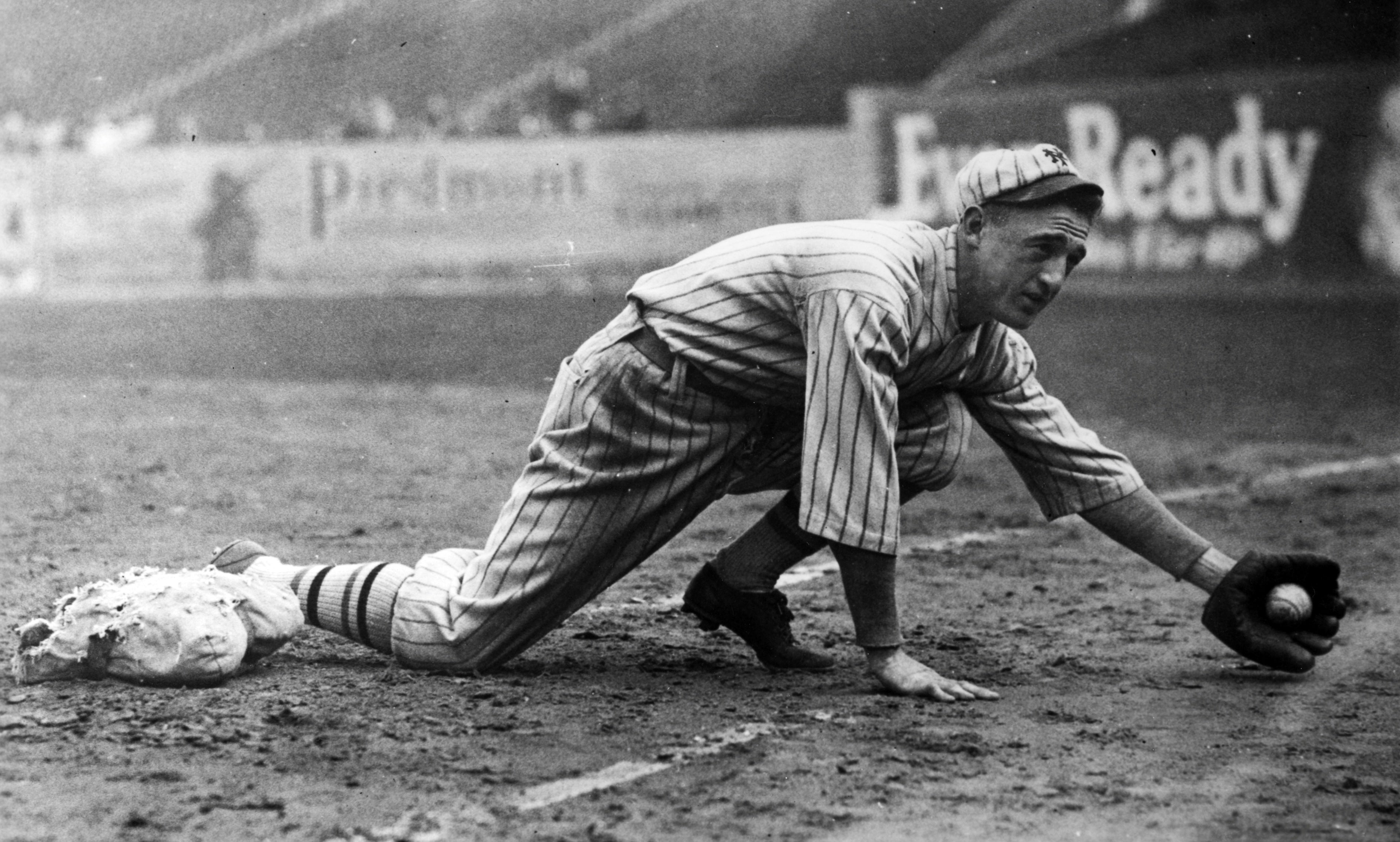 Frankie Frisch reaching for a ground ball