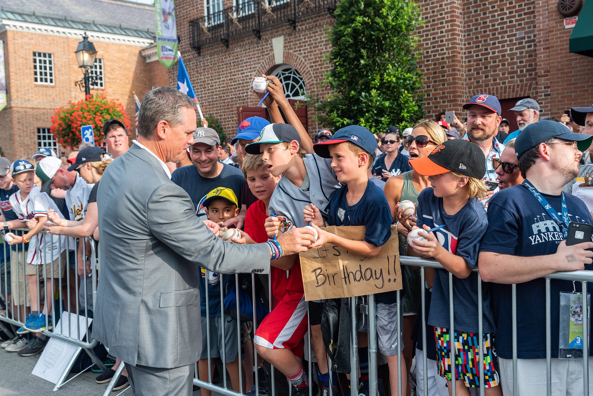 A Hall of Famer signing autogrpahs outside of the Museum