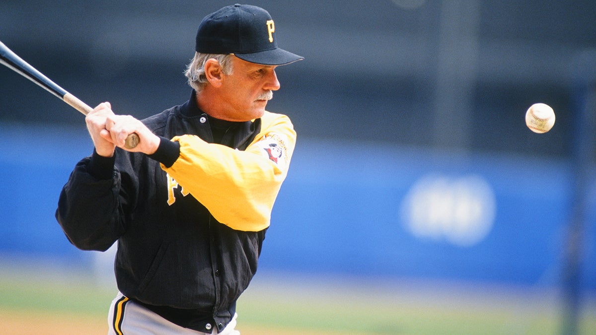 Jim Leyland in Pirates jacket hitting fungo
