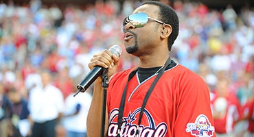 Nikko Smith sings into microphone