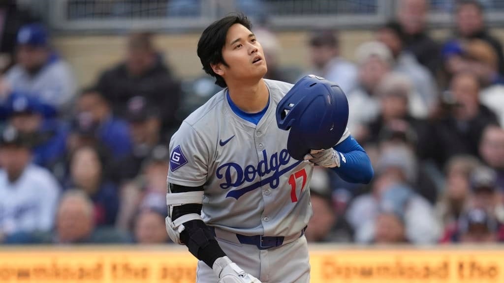 Shohei Ohtani removing his batting helmet