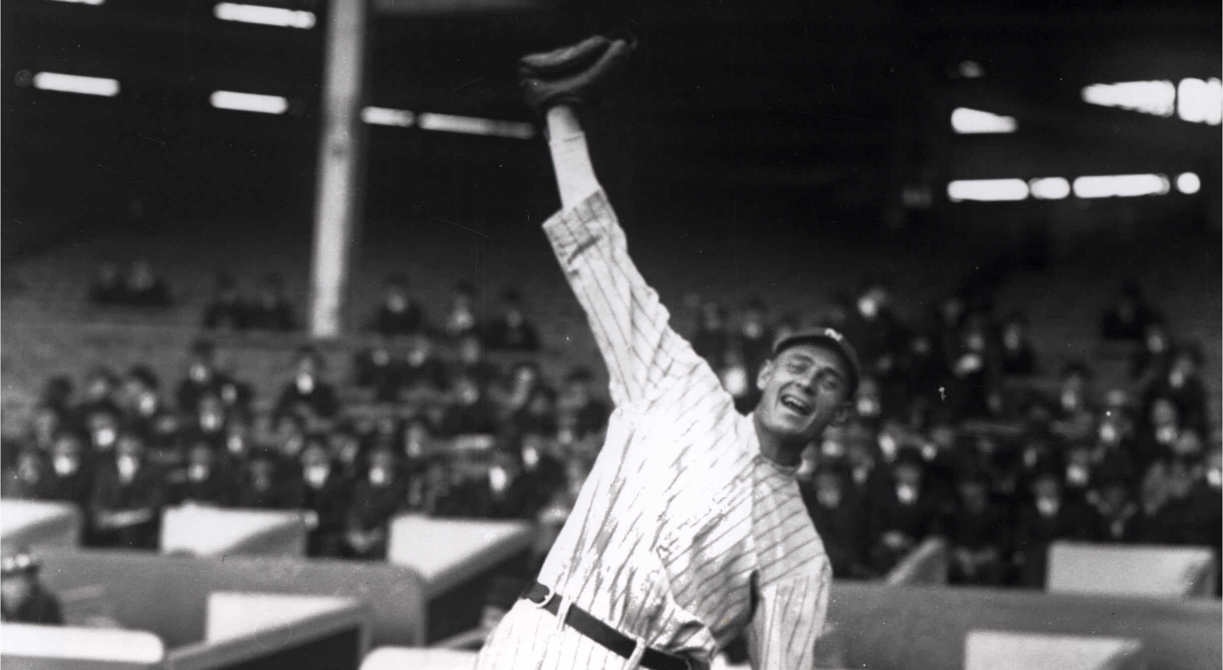 Wally Pipp reaching for a baseball