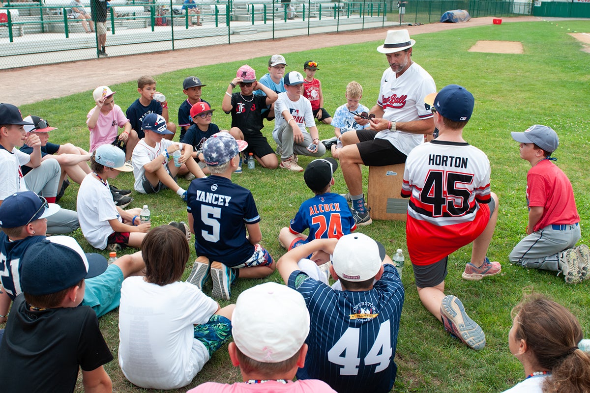 Kids huddle around youth instructor