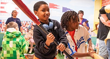 Students in Baseball Discovery Zone